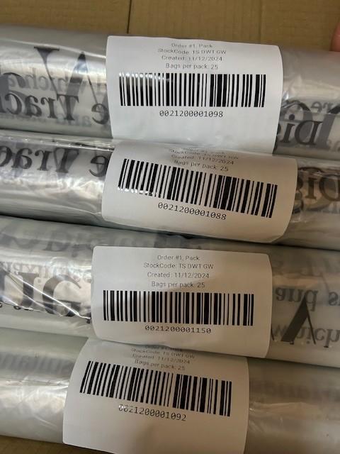 Rolls of barcoded DWT tracked waste sacks, each bag individually identifiable