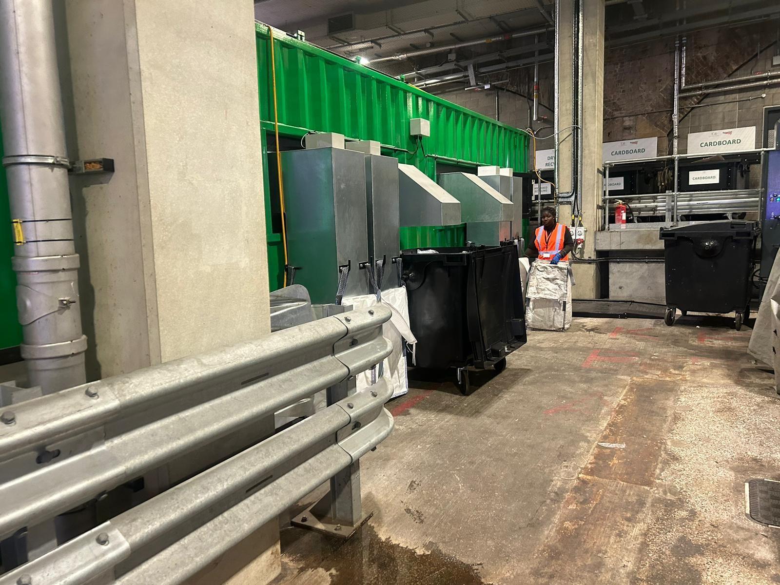 Commercial waste facility with bins staged for transport